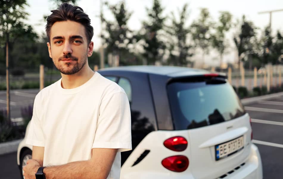 Man Standing by Car